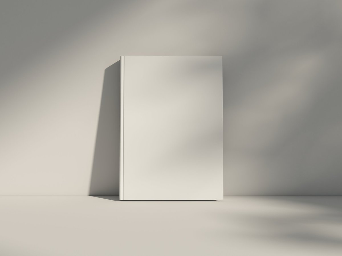 Clean hardcover book mockup standing vertically on a table
