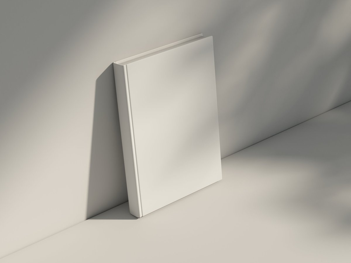 Elegant book cover mockup on a wooden surface with soft shadows